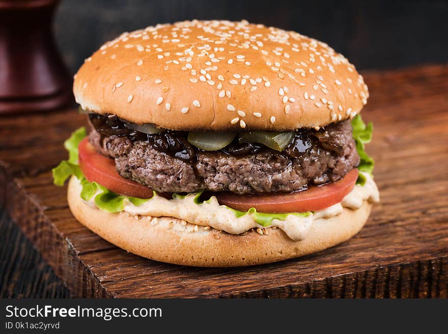 fresh tasty burger on wood table. fresh tasty burger on wood table