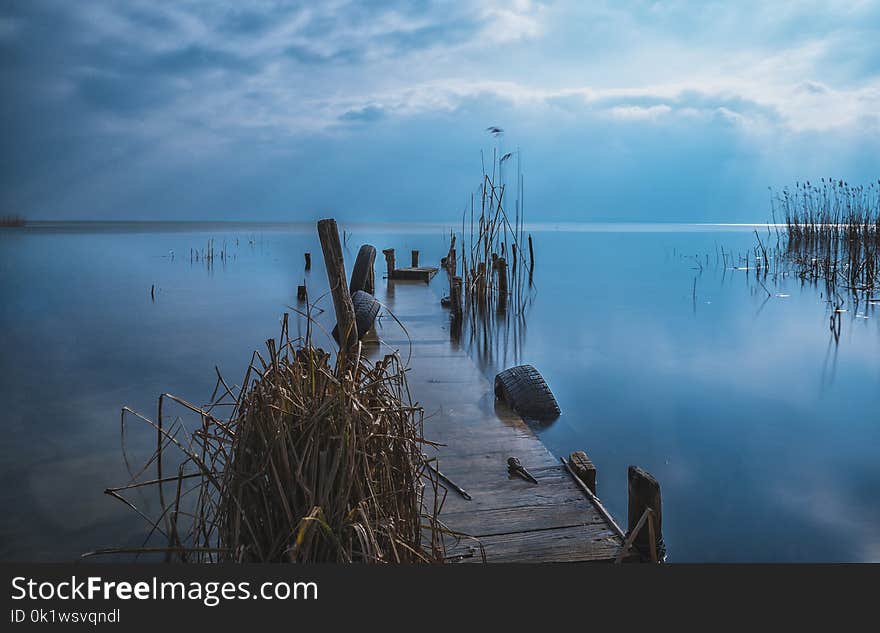 Brown Wooden Dock during Sunset