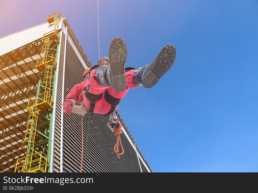 workers wear safety harness, protective equipment for the high place in ship yard and constructionbackground. workers wear safety harness, protective equipment for the high place in ship yard and constructionbackground