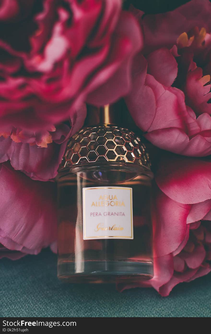 Perfume Bottle Surrounded by Flowers