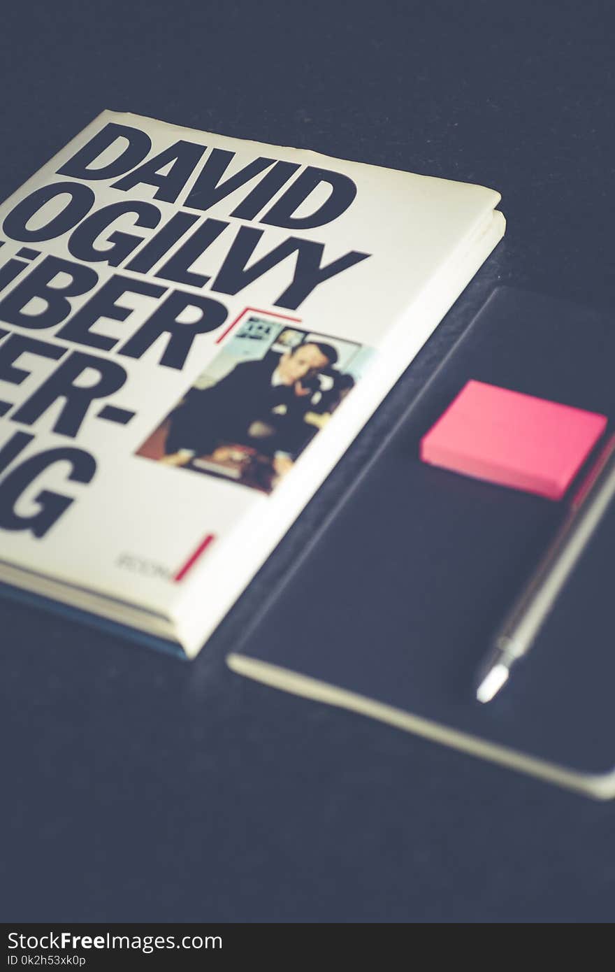 David Ogilvy Book Lying Beside Black Leather Booklet