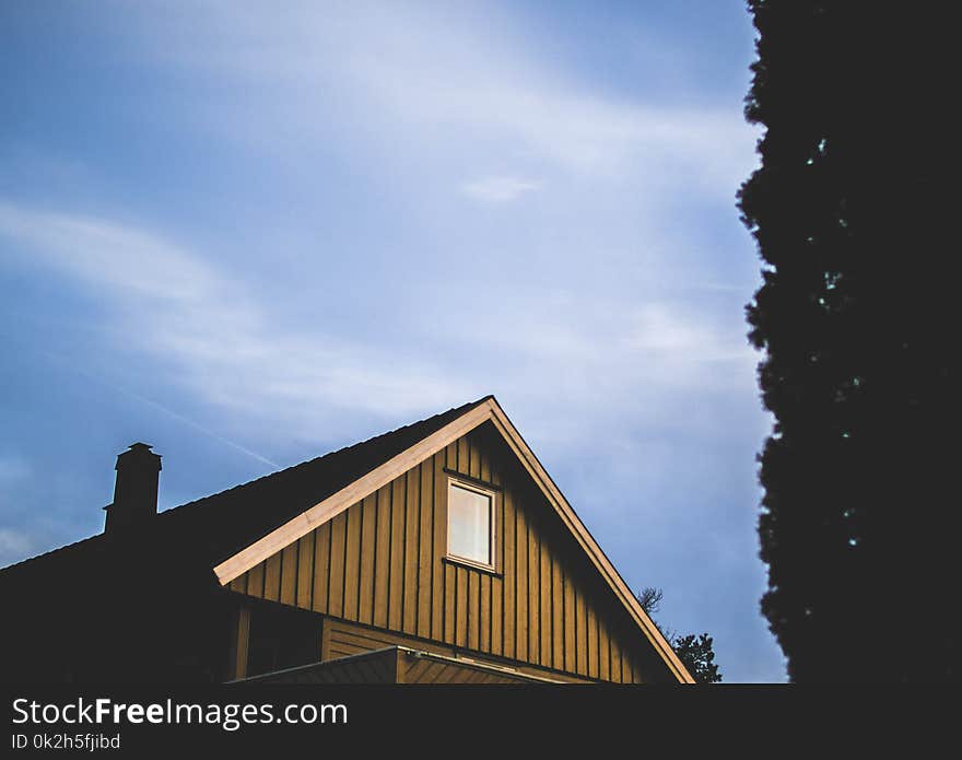 Brown Wooden House Under Blue Sky at Daytime