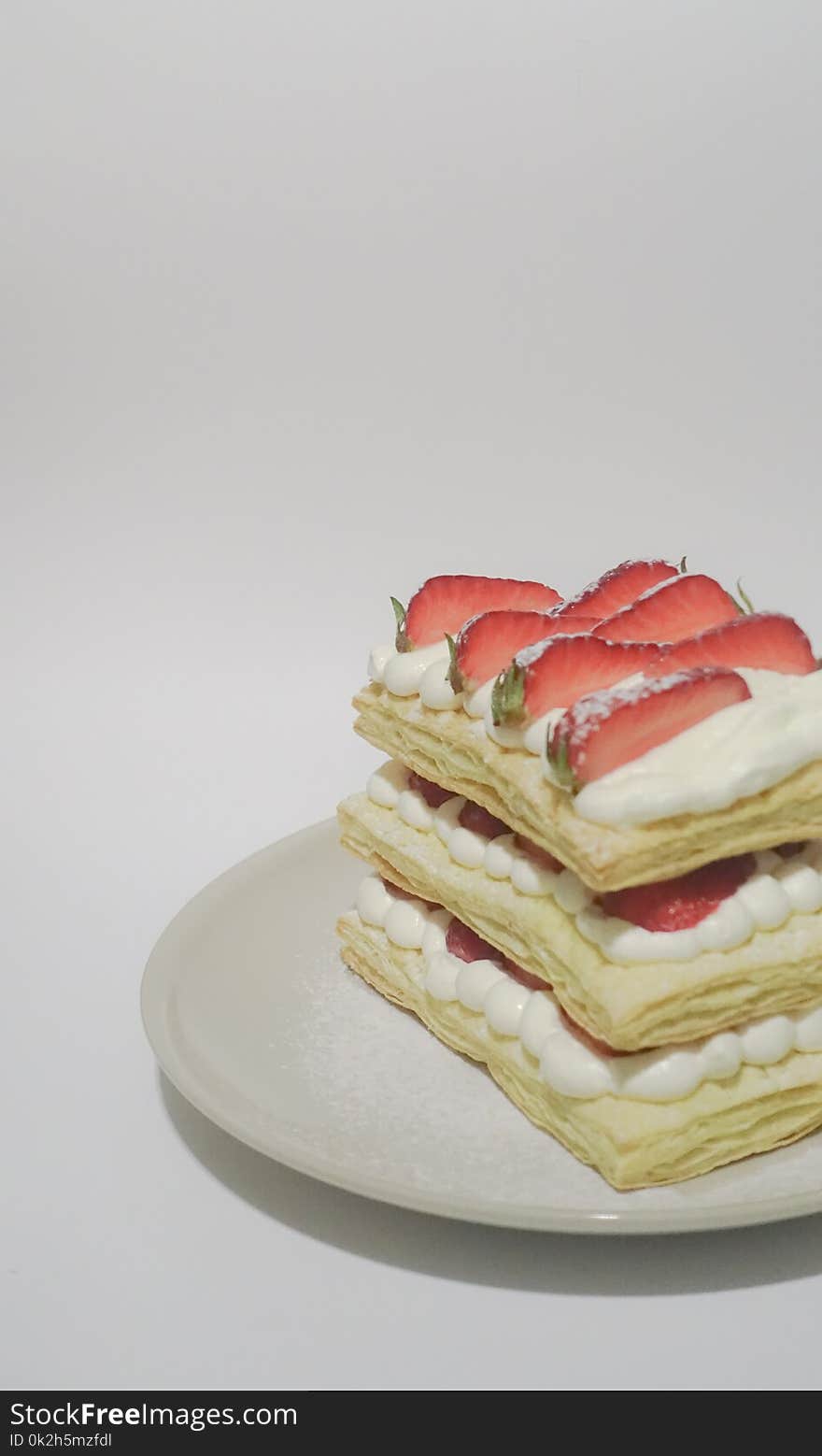 Biscuits With Cream and Sliced Strawberry Toppings