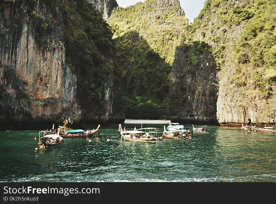 Brown Wooden Boats on River