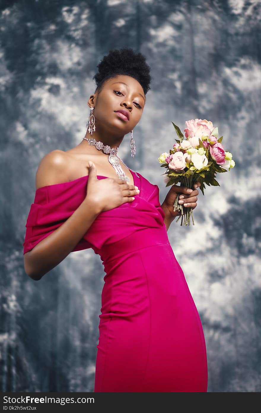 Woman in Pink Off-shoulder Dress Holding Pink and White Flower Bouquet