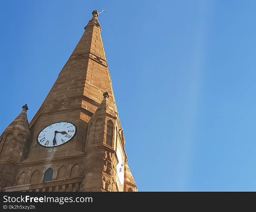 Photo of Brown Clock Tower