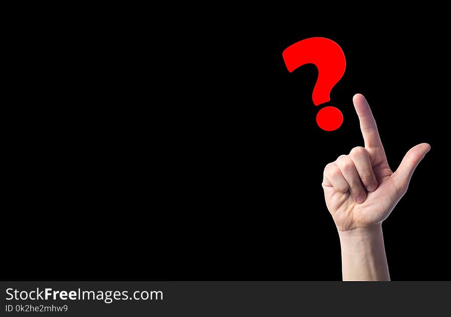 Finger points to question marks on black isolated background. concept of the question. the problem of choice, meditation, a diffic