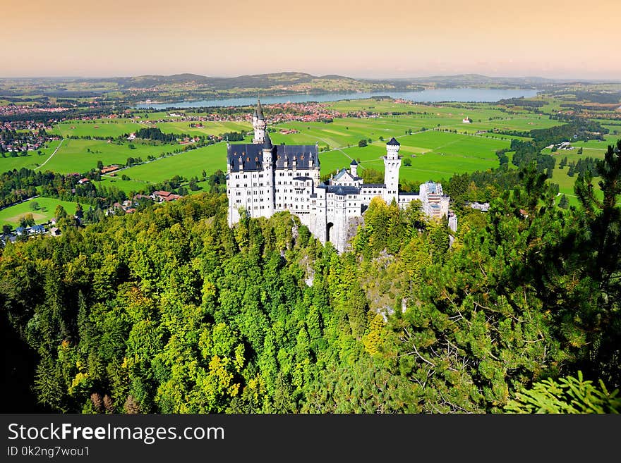 Famous Neuschwanstein Castle, 19th-century Romanesque Revival palace on a rugged hill above the village of Hohenschwangau in south