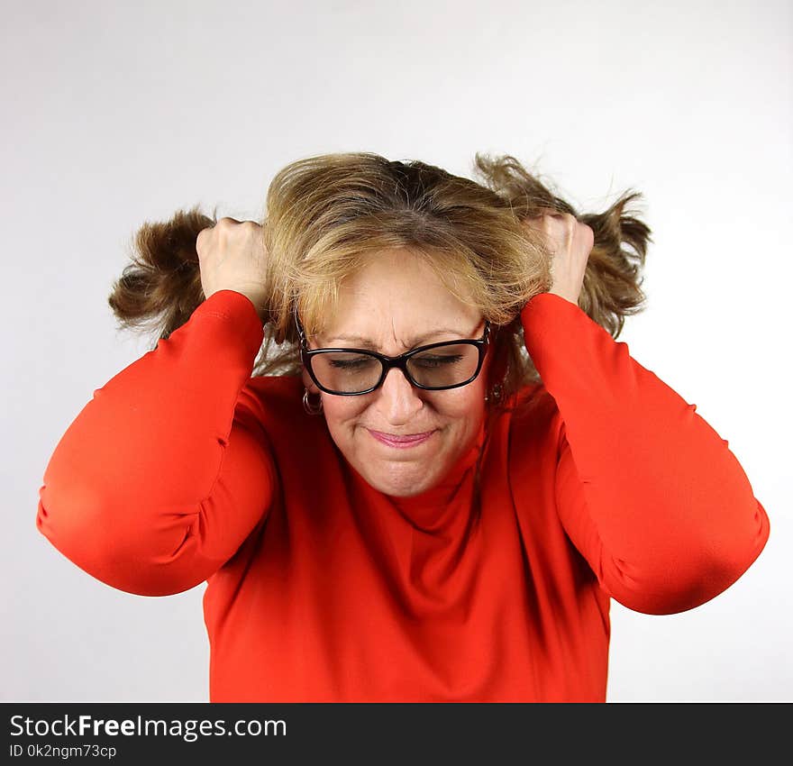 Frustrated business woman pulling her hair out