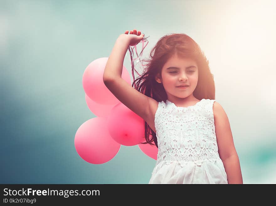 Happy girl with air balloons