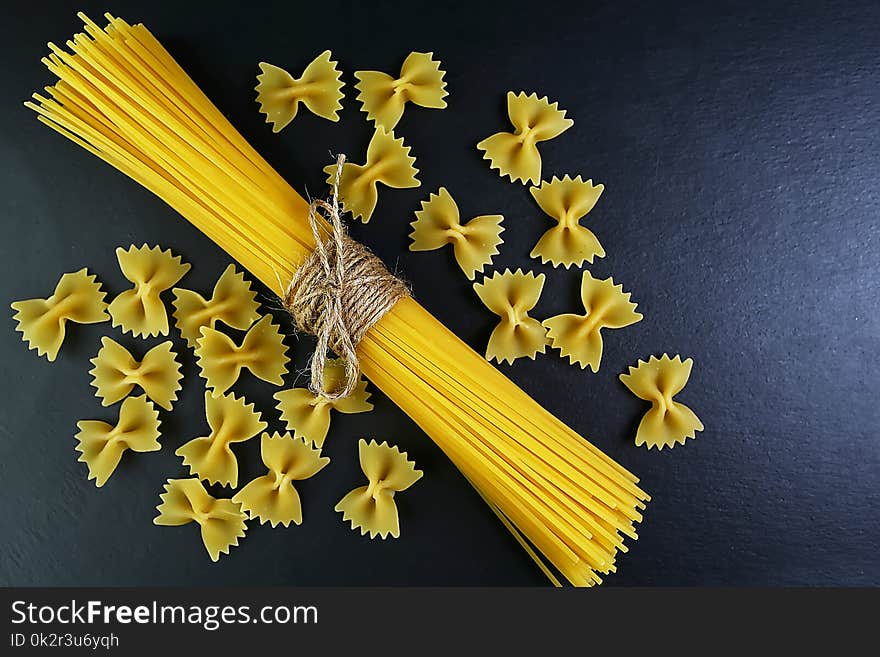 Different kinds of pasta, background of food ingredients, image of the concept of advertising in a restaurant or market, place to copy text, set.