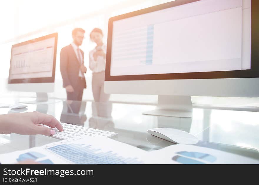 Close-up of a business woman working with financial charts in a