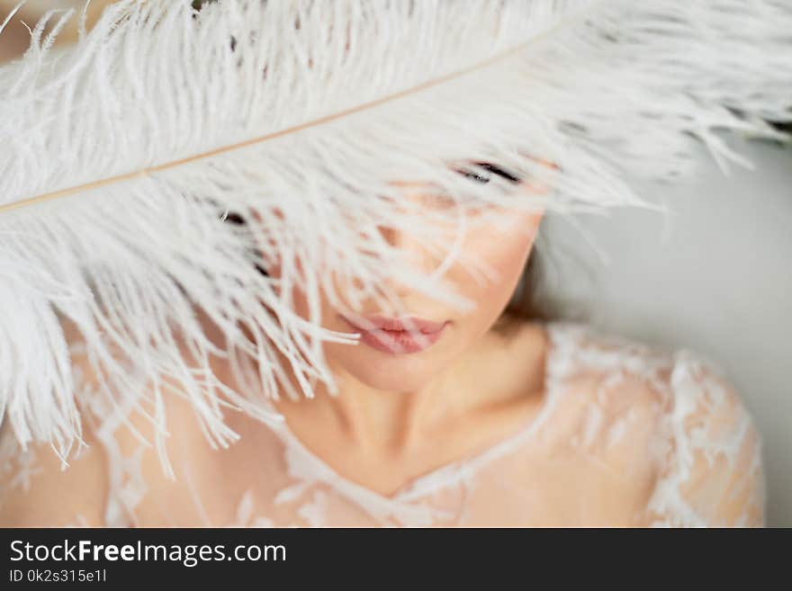 Bright Studio.Delicate and sensual atmosphere of peace and tranquility.Relaxation. Portrait of a beautiful girl with