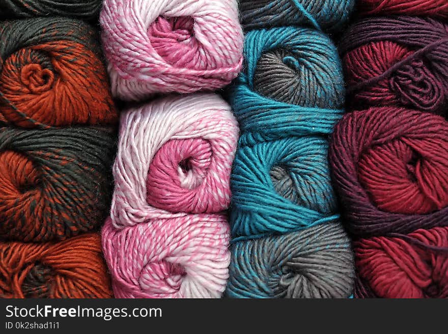 Colorful balls of wool, close up background