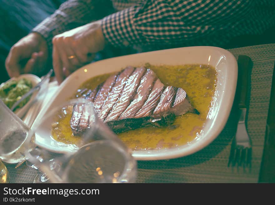 Plate With Grilled Tuna On Table In Restaurant