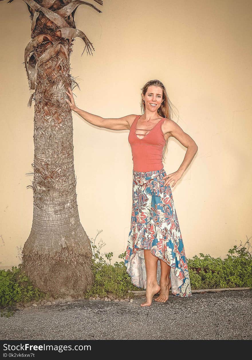 Woman Posing Near Tree