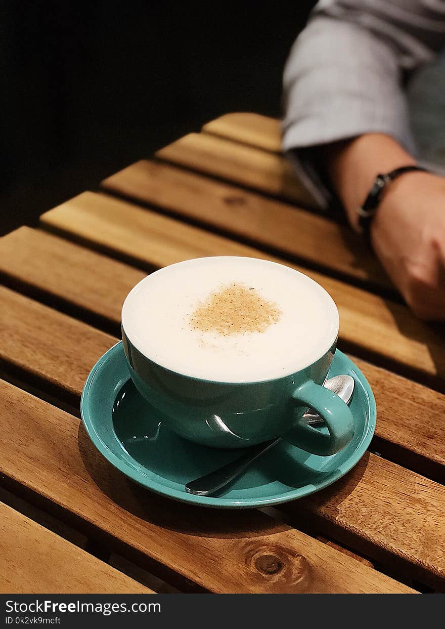 Cappuccino on Teal Ceramic Cup and Saucer