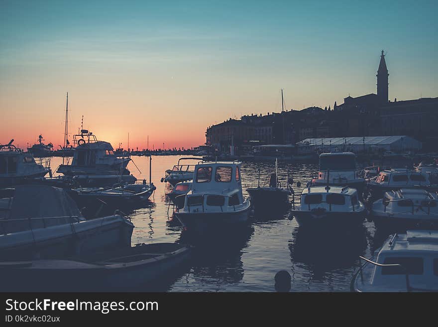 Bunch of Boats on Body of Water during Golden Hour