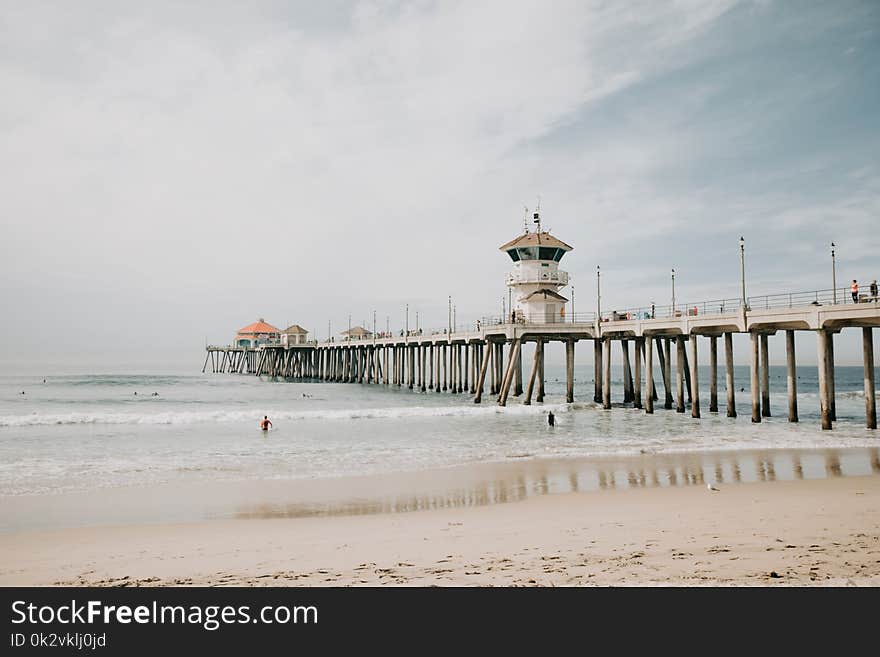 Photo of White Concrete Dock Bridge on Ocean