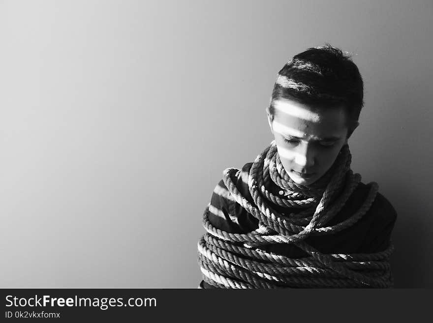 Grayscale Photography of Person Bind in Rope