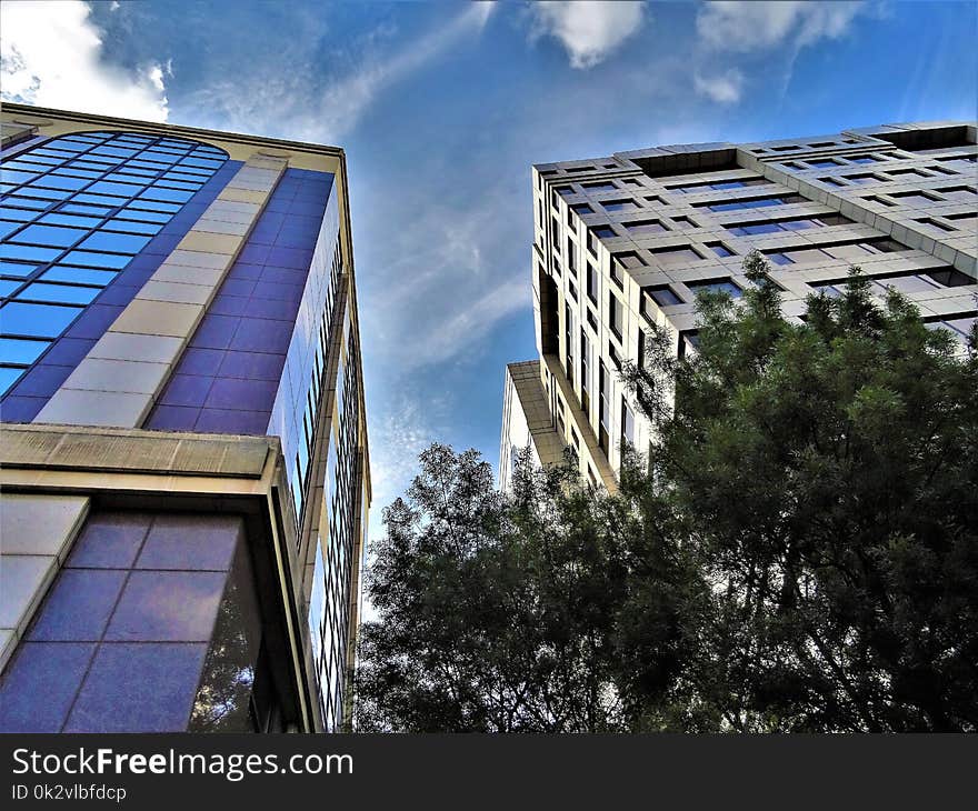 Concrete Building Photo Under Cloudy Sky