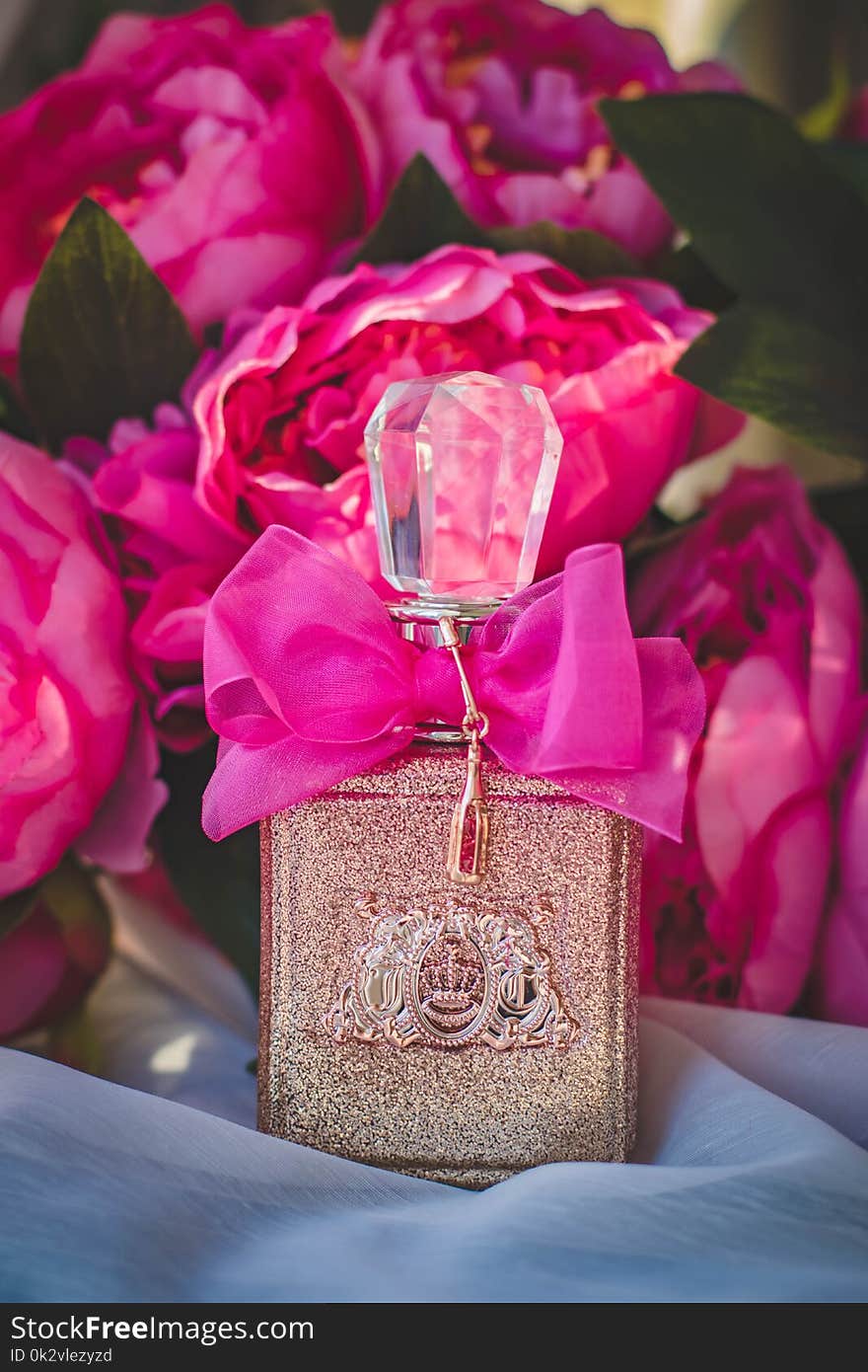 Gray and Pink Labeled Fragrance Bottle