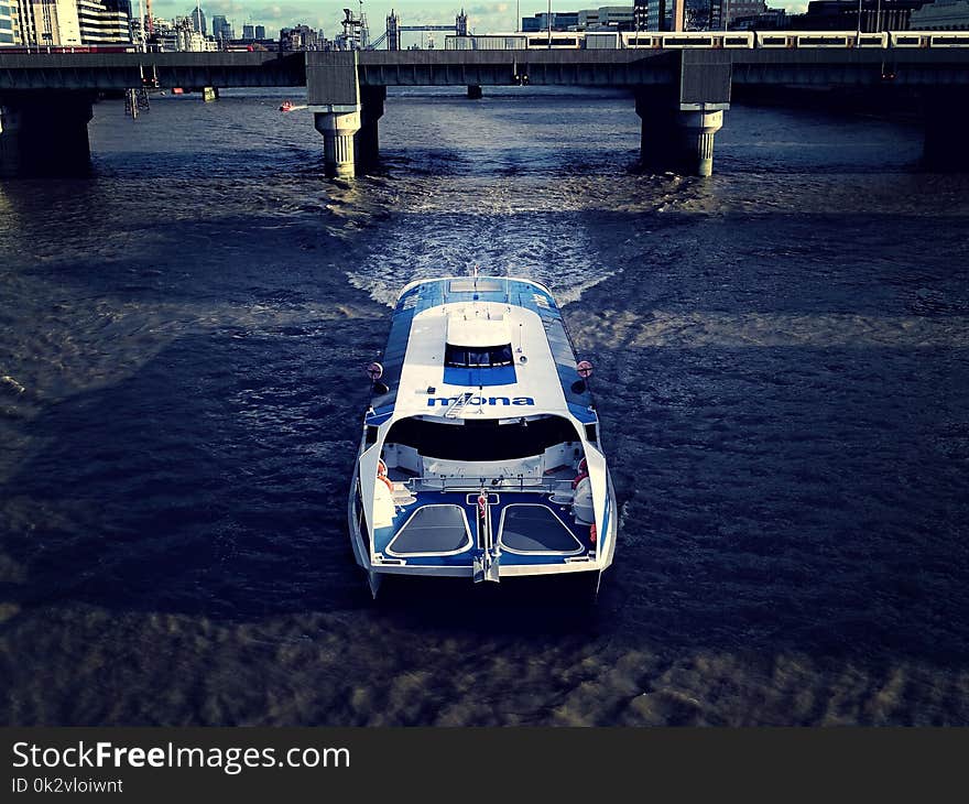 Photography of White And Blue Boat