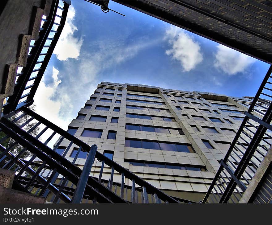 Low-angle Photography of High Rise Building Under Stratus Clouds