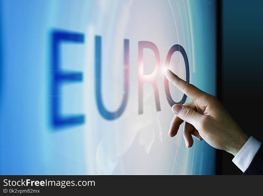 Businessman touching the screen about euro currency