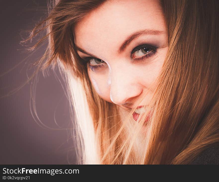 Charm and flirt concept. Lovely charming lady portrait with flirting eye looking and smile. Joyful happy young blonde woman model. Charm and flirt concept. Lovely charming lady portrait with flirting eye looking and smile. Joyful happy young blonde woman model.