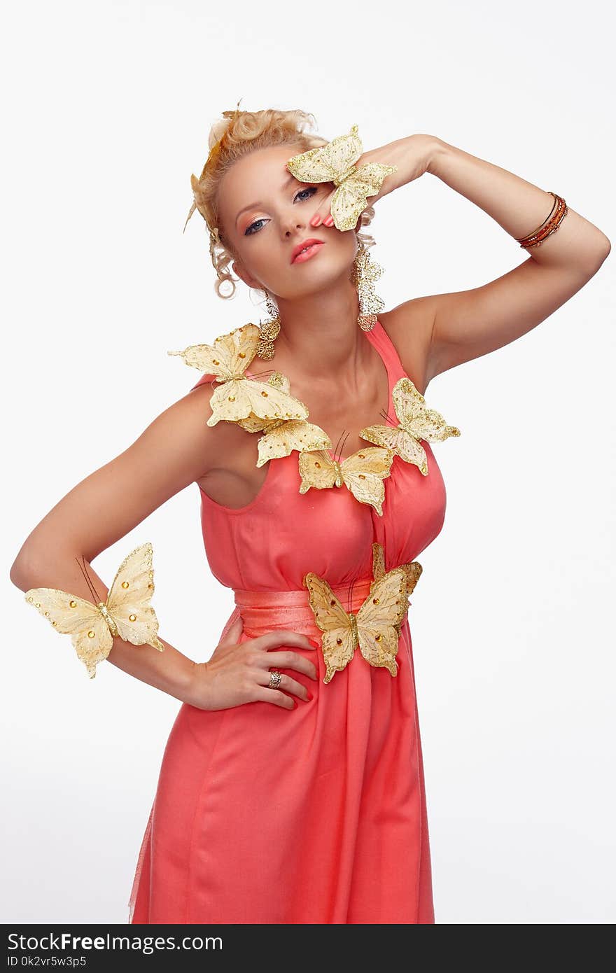 Blond woman in a red dress with butterfly isolated on a white background. Blond woman in a red dress with butterfly isolated on a white background.