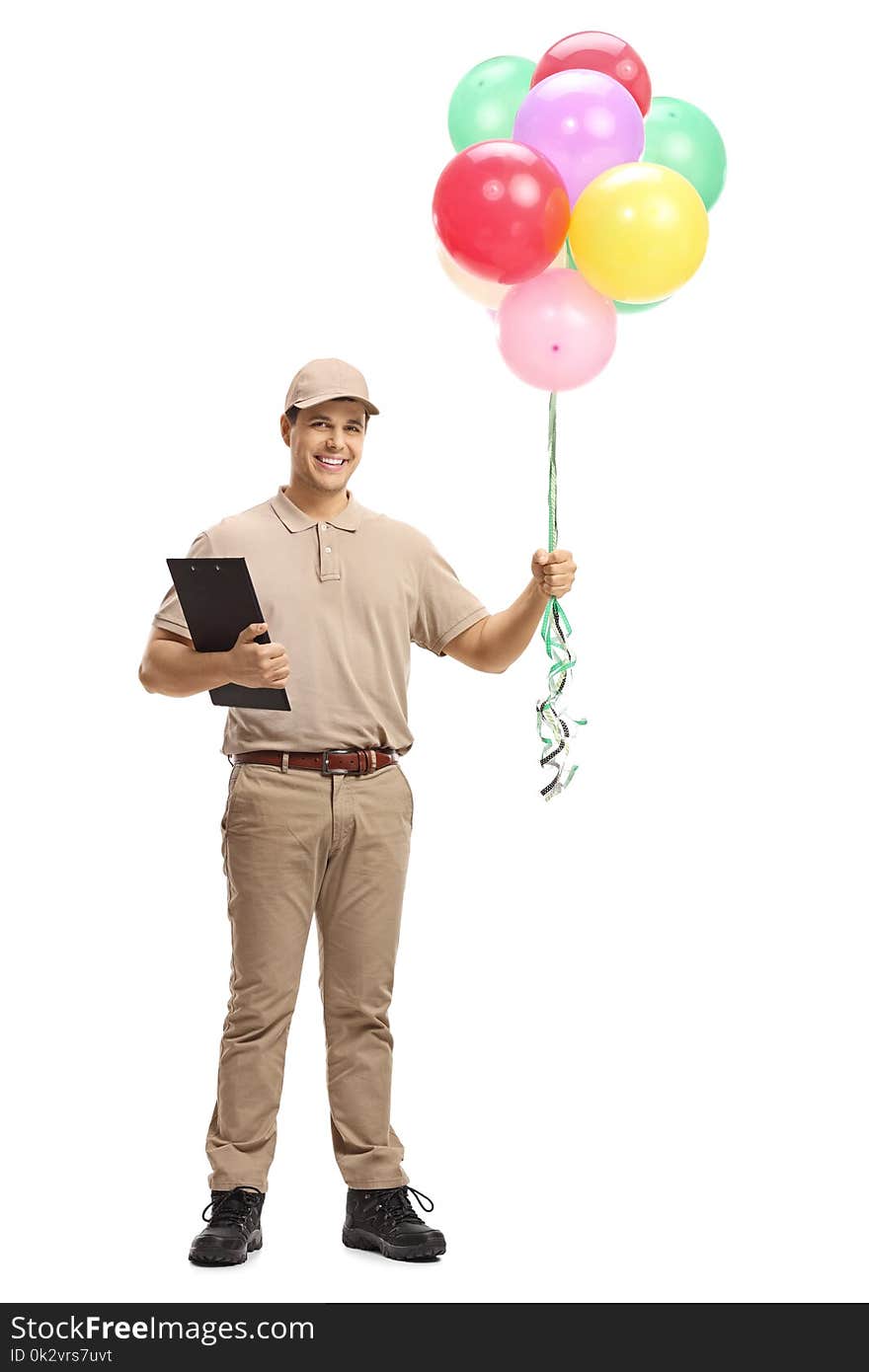 Full length portrait of a delivery man with a clipboard and balloons isolated on white background