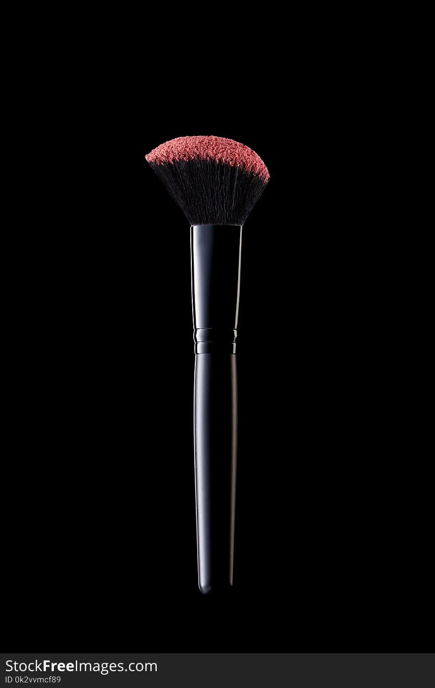 Makeup Brush On Black Background. Close Up Of Professional Cosmetics Soft Blush Brush With Violet Powder. Makeup Tools. High Quality Image.