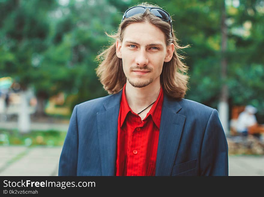 A man with long hair in buisness. A man with long hair in buisness