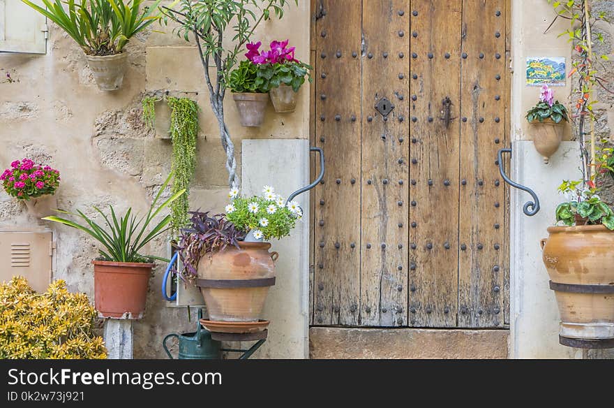 Beautiful street in Valldemossa with traditional flower decoration, famous old mediterranean village of Majorca. Balearic island