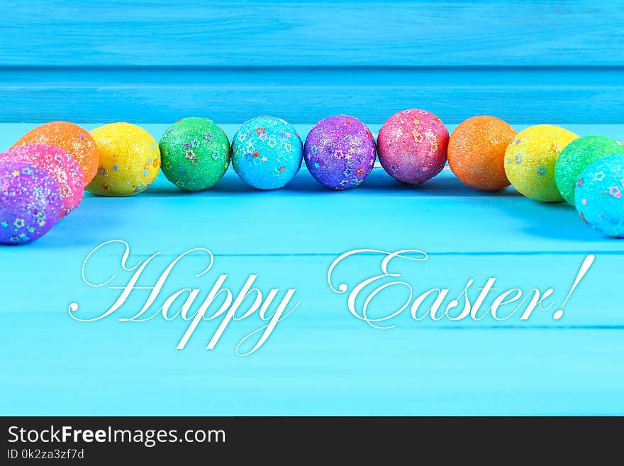 Colorful Easter Egg On Blue Pastel Color Wood Background With Space. Happy Easter.