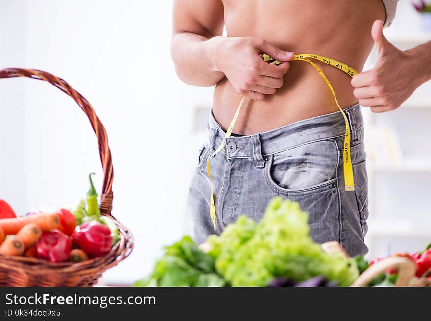 The young man in healthy eating and dieting concept