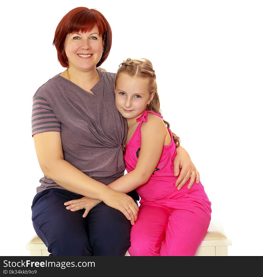 Portrait of mother and little daughter 7 years old