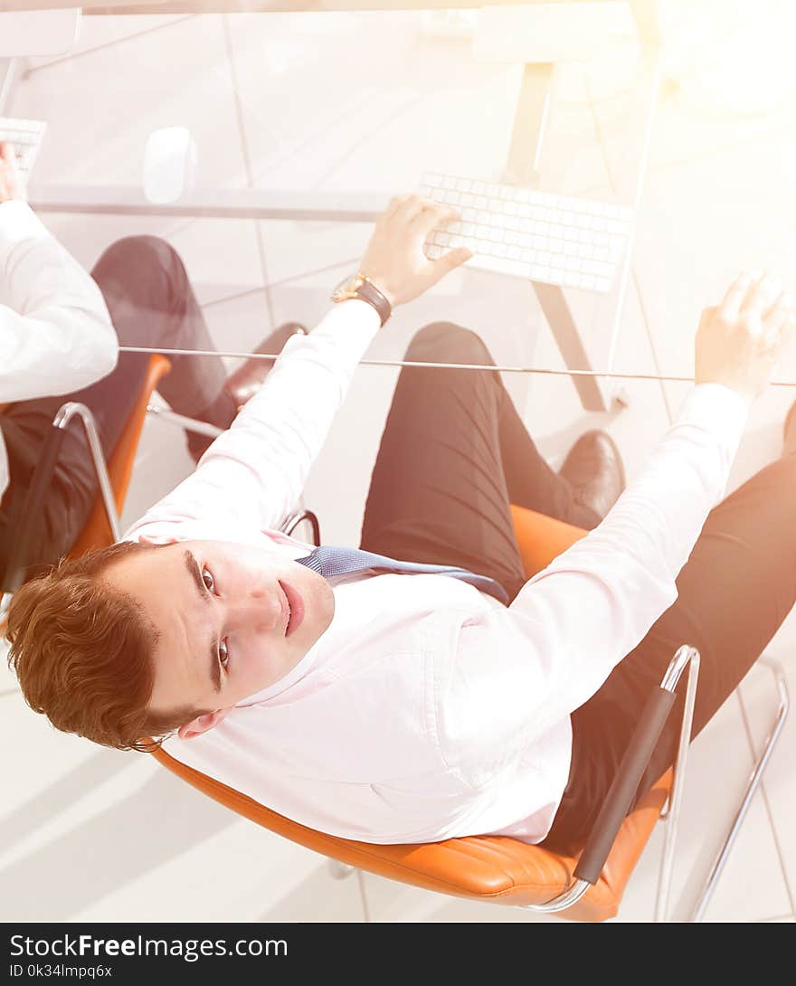 Office life.employees sitting behind a Desk