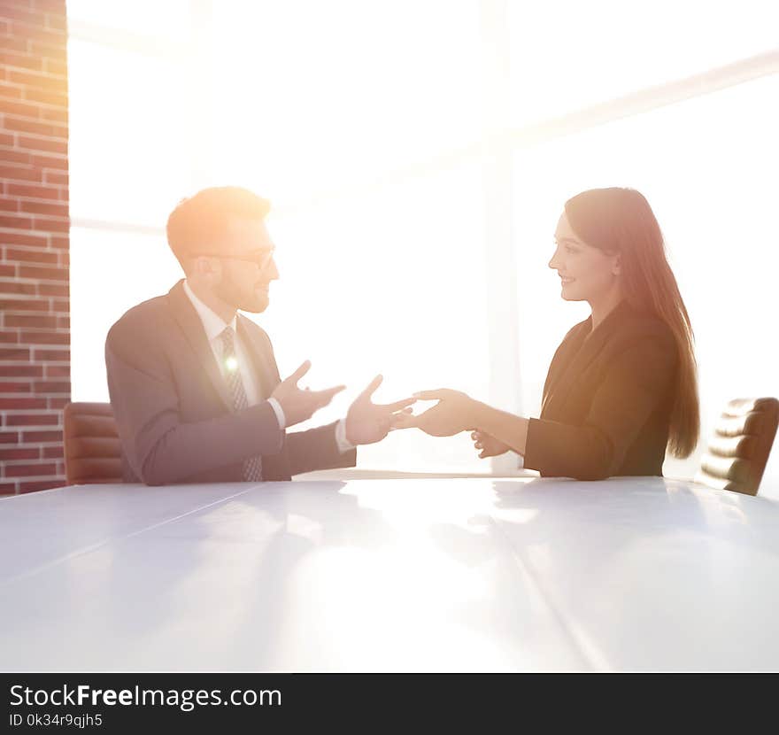 Young businessman discussing something with his colleague. Young businessman discussing something with his colleague