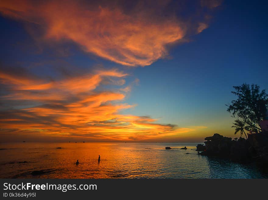 Beautiful island with palm trees at sunset in summer day. Beautiful island with palm trees at sunset in summer day.