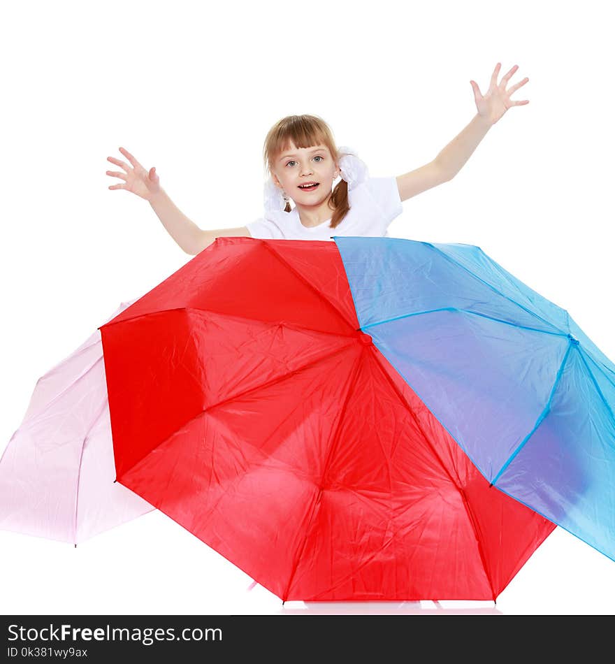 Funny little blonde girl with pigtails and white bows on her head in a white T-shirt and shorts.She raised her arms and waved them. Funny little blonde girl with pigtails and white bows on her head in a white T-shirt and shorts.She raised her arms and waved them.