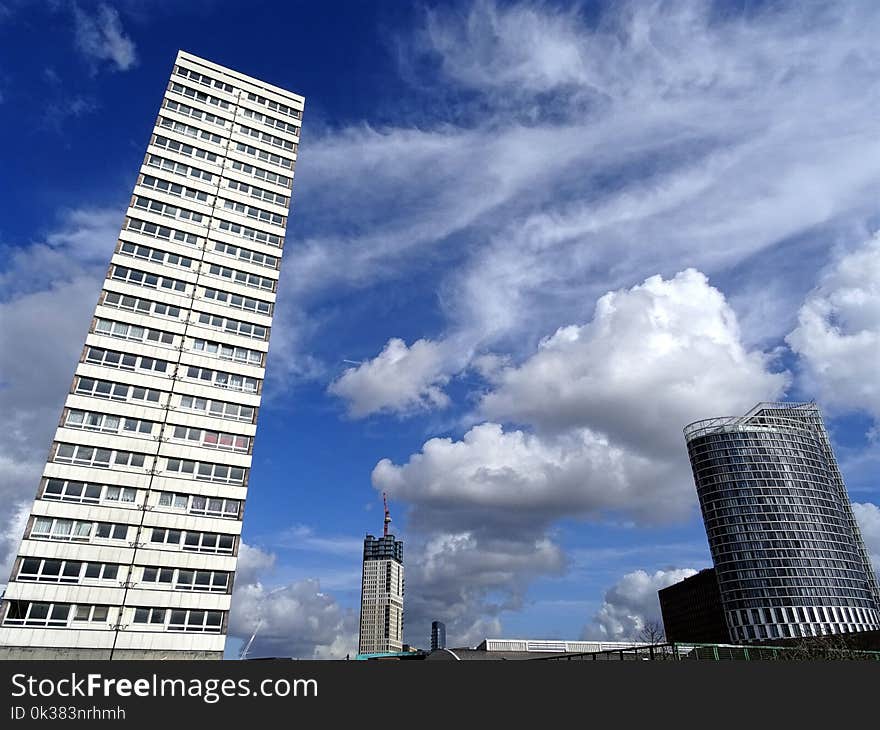 Photo of Two White and Black High Rise Buildings