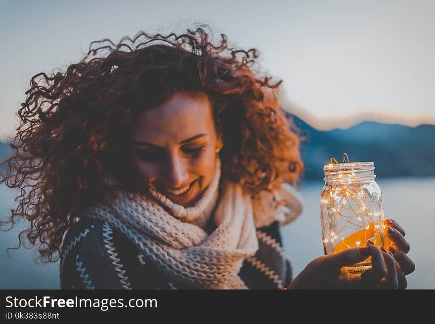 Woman Holding Lighted Jar