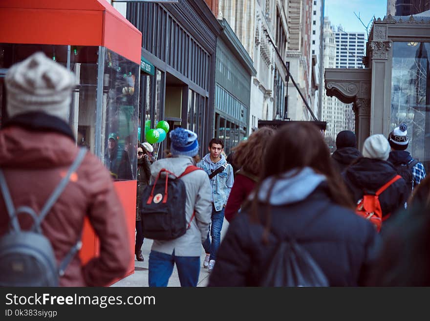 People Walking on Sidewalk