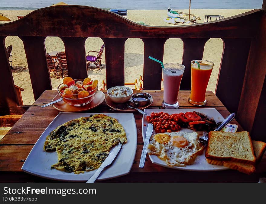 Fried Egg and Egg Omelet on Plate