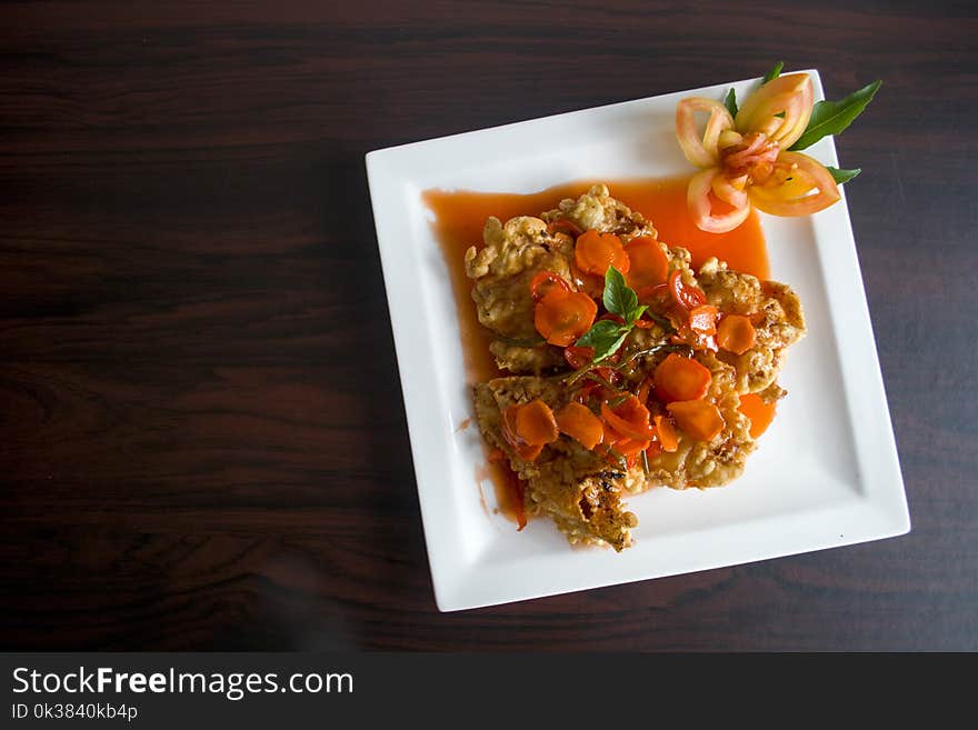 Brown Fried Food With Orange Soup on Ceramic Plate