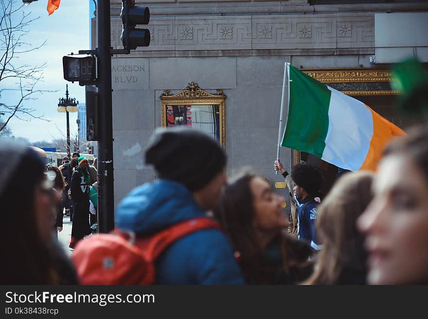 Group of People Gathering on Road Near Building