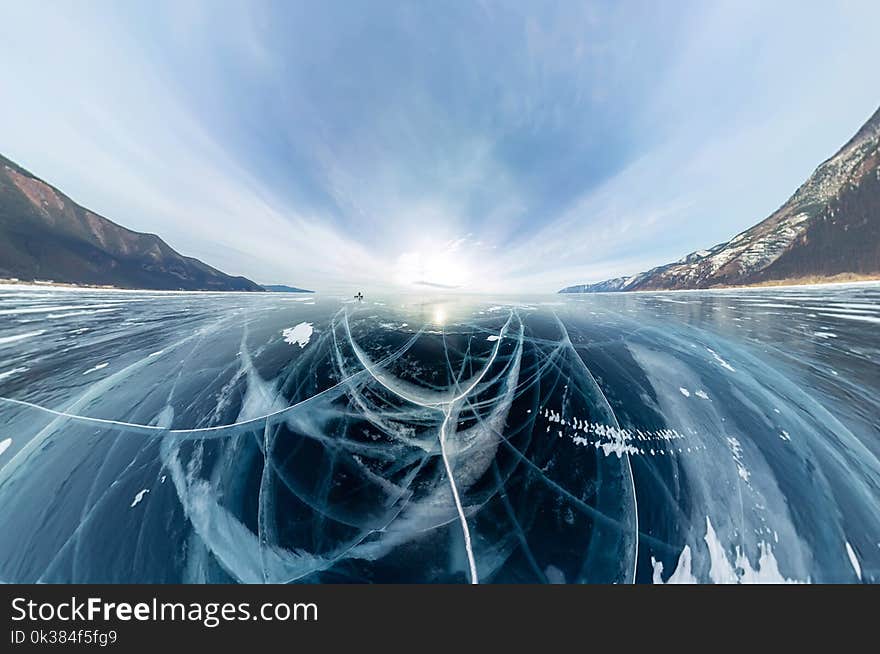 Panorama cracks on blue ice of Lake Baikal from Olkhon.