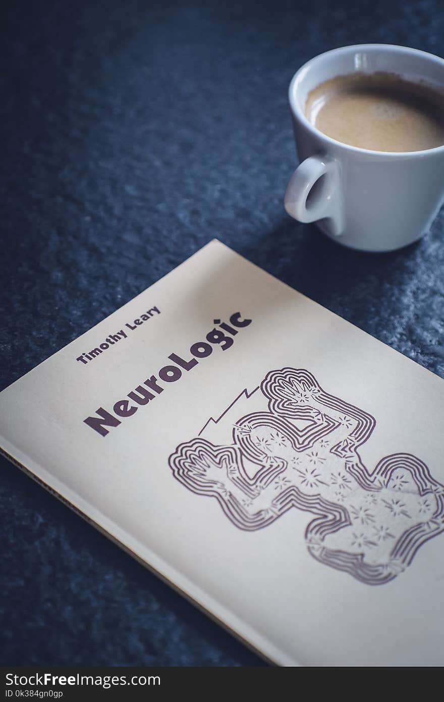 Timothy Leary&#x27;s Neurologic Book Near White Ceramic Cup